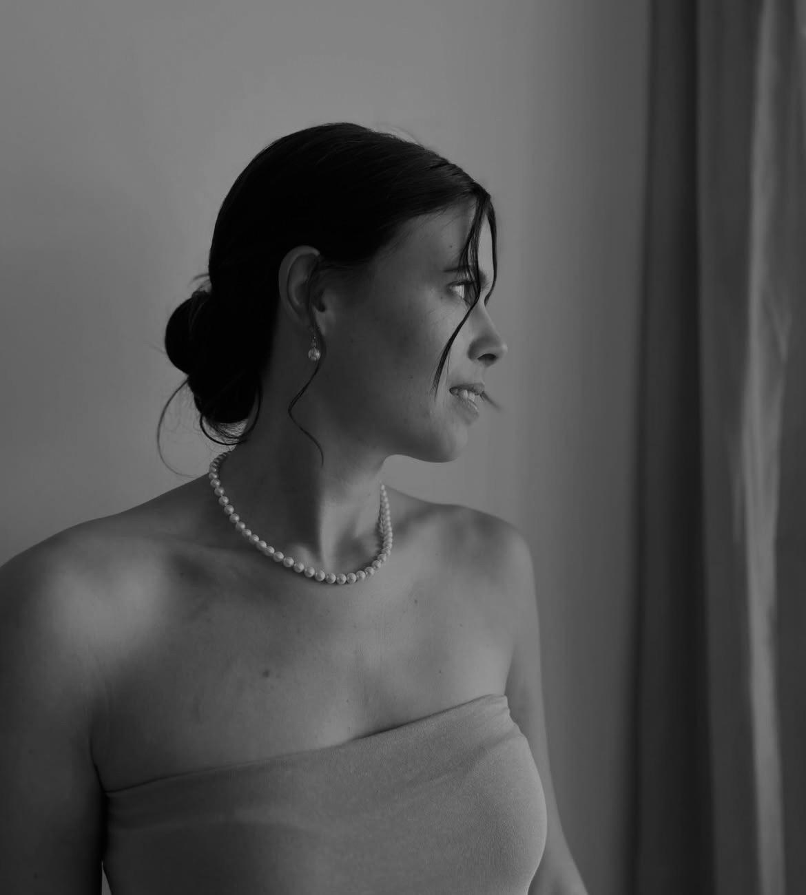 Elegante Brauthochsteckfrisur mit weichen Wellen